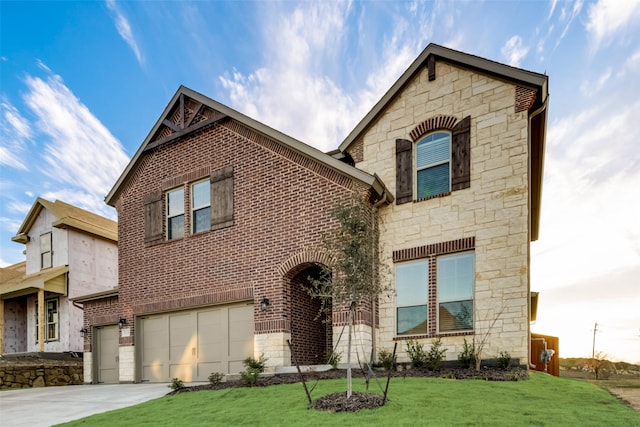 view of front of property with a front lawn and a garage