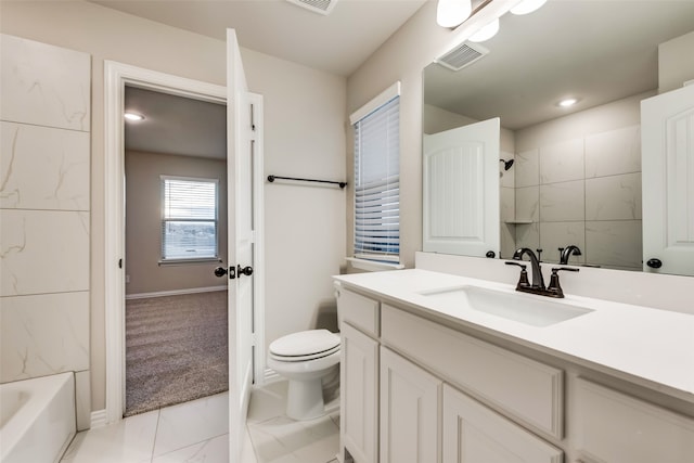 full bathroom featuring vanity, toilet, and tiled shower / bath combo