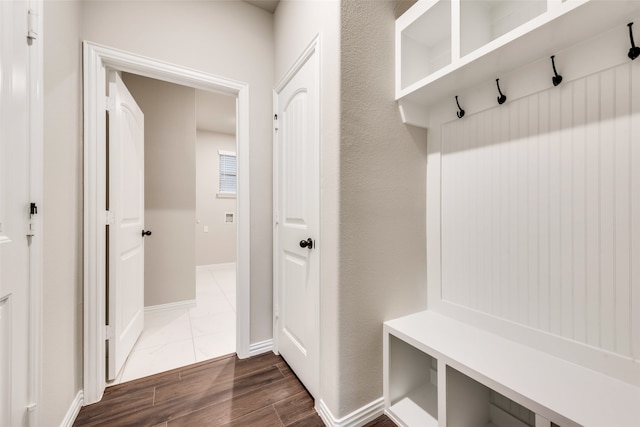 mudroom with dark wood-type flooring