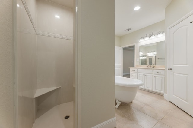 bathroom with separate shower and tub, vanity, and tile floors