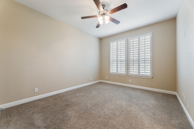 carpeted empty room featuring ceiling fan