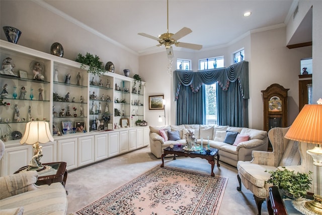 living room featuring light carpet, crown molding, and ceiling fan