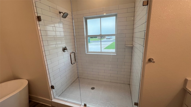 bathroom with a shower with shower door