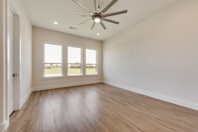 spare room with light hardwood / wood-style flooring and ceiling fan