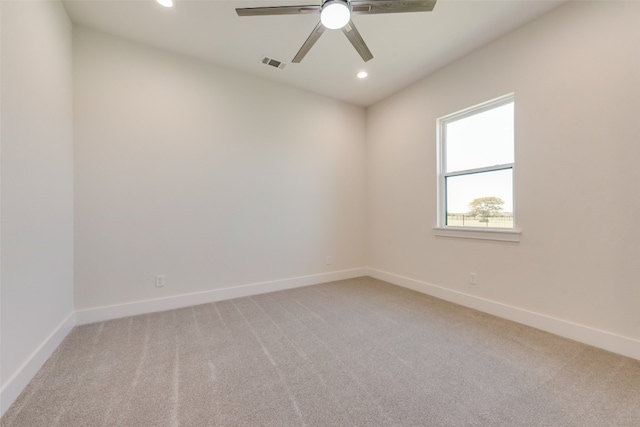 spare room featuring carpet flooring and ceiling fan