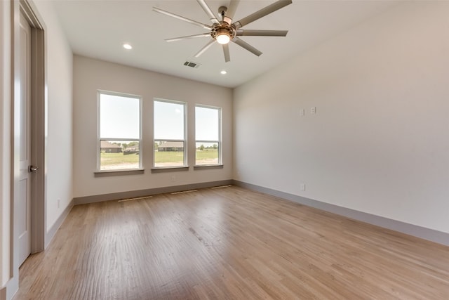 unfurnished room with ceiling fan and light hardwood / wood-style flooring