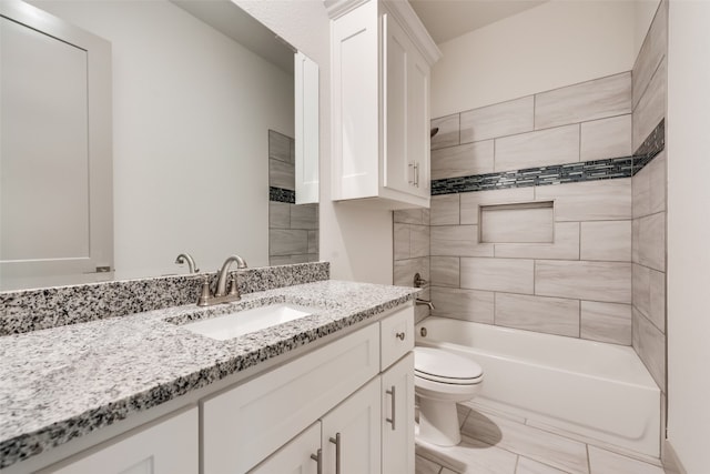 full bathroom with vanity, toilet, and tiled shower / bath combo