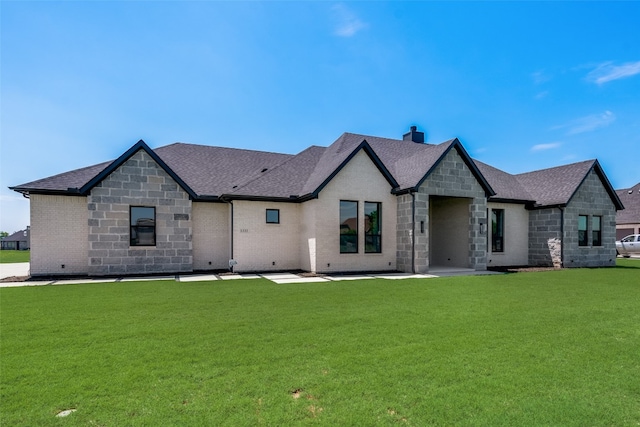 french country style house featuring a front lawn