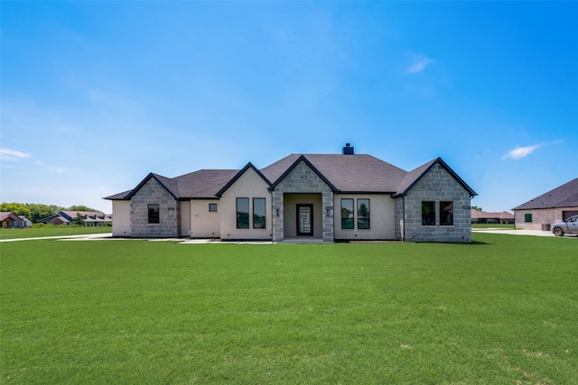 french provincial home with a front lawn