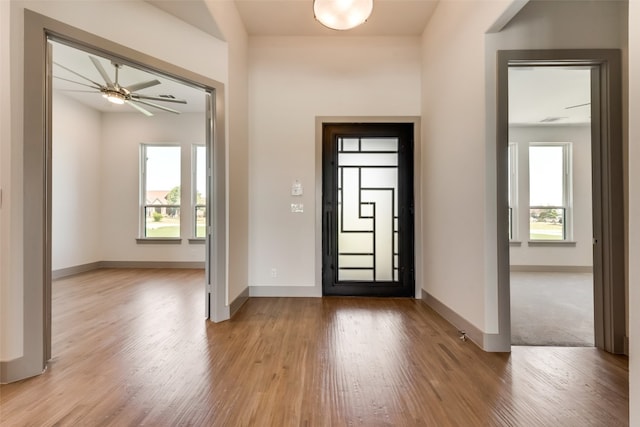 entrance foyer featuring light hardwood / wood-style flooring and ceiling fan