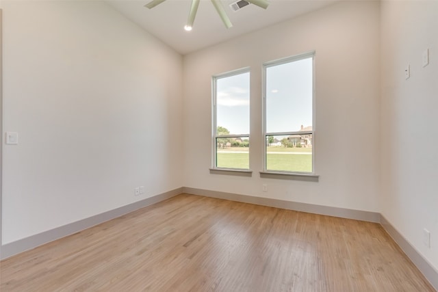 empty room with light hardwood / wood-style flooring