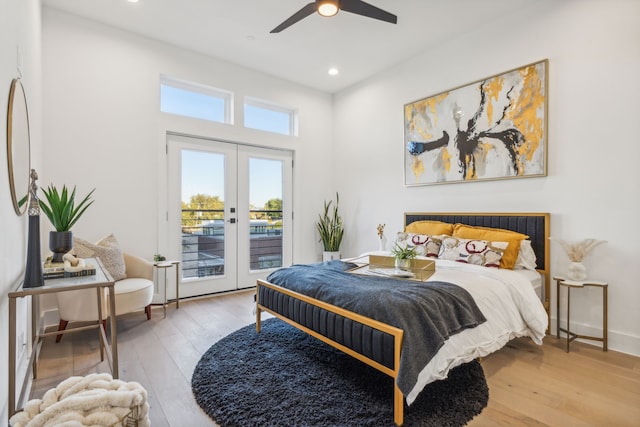 bedroom with access to exterior, french doors, light hardwood / wood-style flooring, and ceiling fan