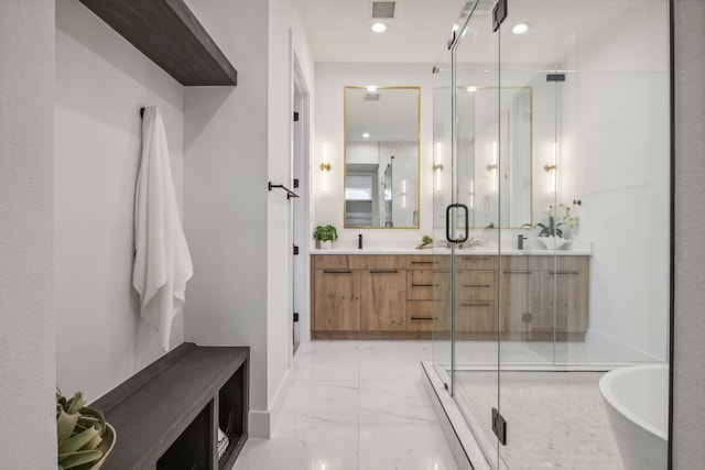 bathroom featuring separate shower and tub and vanity