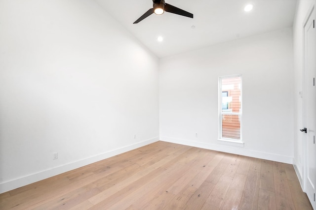 spare room with ceiling fan, light hardwood / wood-style floors, and lofted ceiling