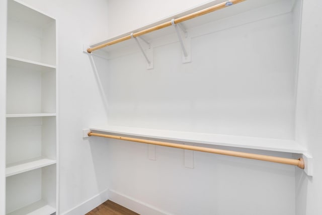 spacious closet featuring hardwood / wood-style floors