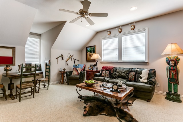 living room featuring vaulted ceiling, ceiling fan, and light colored carpet