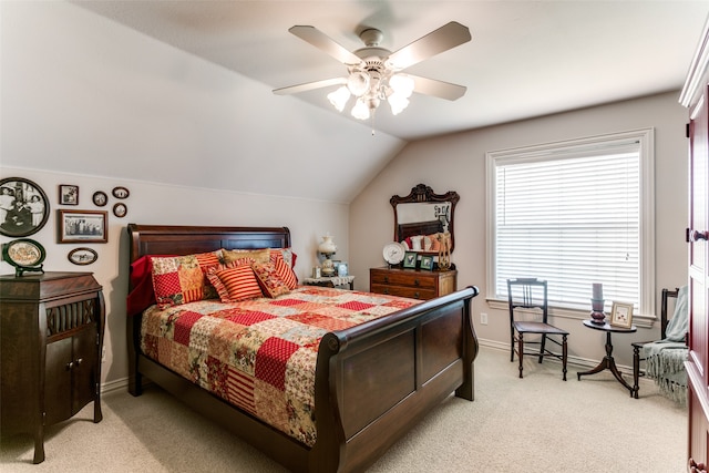 carpeted bedroom with lofted ceiling and ceiling fan