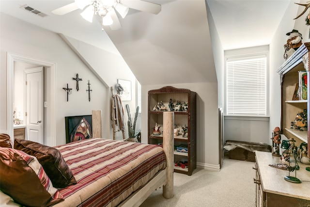 bedroom with ceiling fan, light carpet, and vaulted ceiling