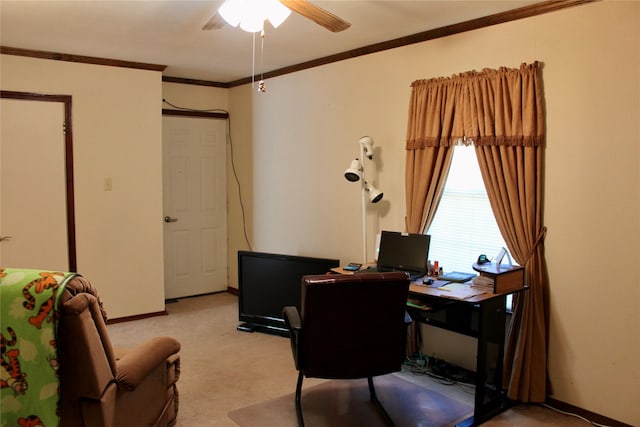 office space featuring light colored carpet, ceiling fan, and ornamental molding