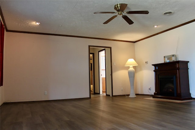 unfurnished living room featuring a textured ceiling, ceiling fan, dark hardwood / wood-style floors, and ornamental molding