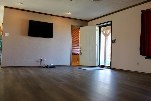 entryway featuring hardwood / wood-style floors and ornamental molding