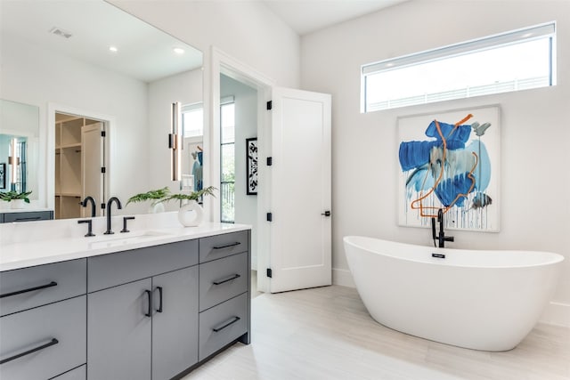 bathroom with vanity with extensive cabinet space