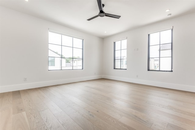 unfurnished room featuring ceiling fan and light hardwood / wood-style flooring