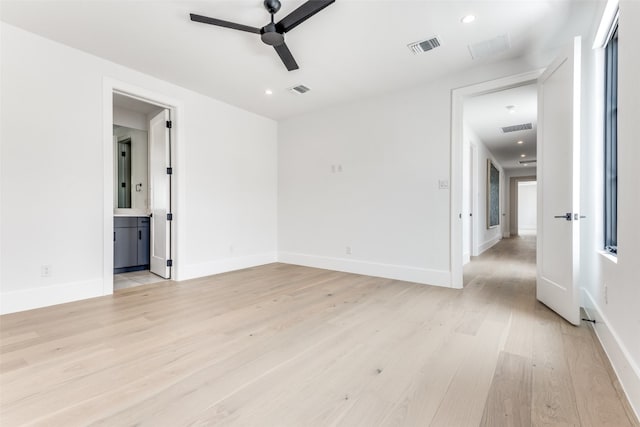 spare room featuring ceiling fan and light wood-type flooring