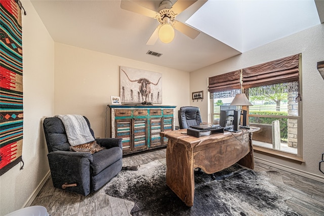 office space with hardwood / wood-style floors and ceiling fan