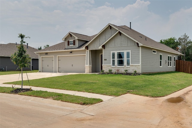 craftsman-style house with a front yard and a garage