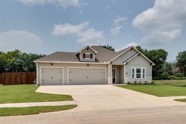 craftsman-style house featuring a front lawn and a garage