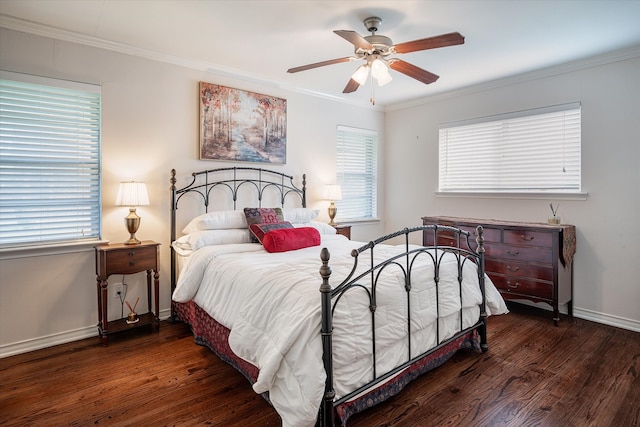 bedroom featuring ceiling fan, dark hardwood / wood-style floors, and multiple windows