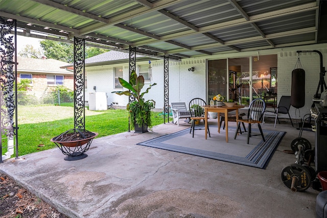 view of patio / terrace with an outdoor fire pit