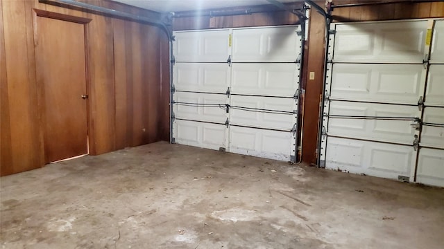 garage featuring wooden walls