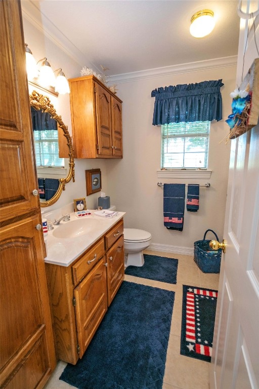 bathroom featuring oversized vanity, toilet, tile floors, and crown molding