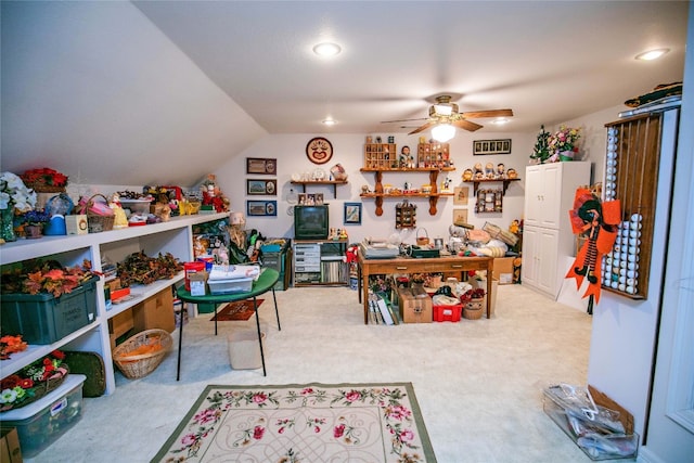 playroom with ceiling fan and light colored carpet