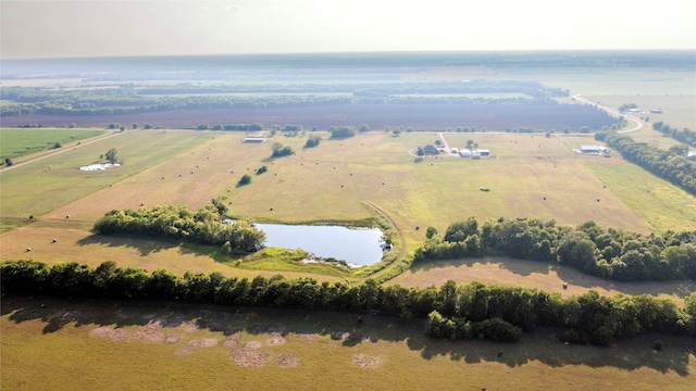 birds eye view of property with a rural view and a water view