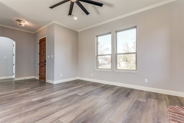 unfurnished room featuring ornamental molding, wood-type flooring, and ceiling fan