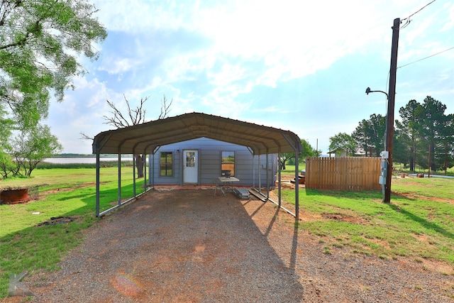 exterior space featuring a lawn and a carport