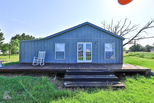 back of property featuring a wooden deck