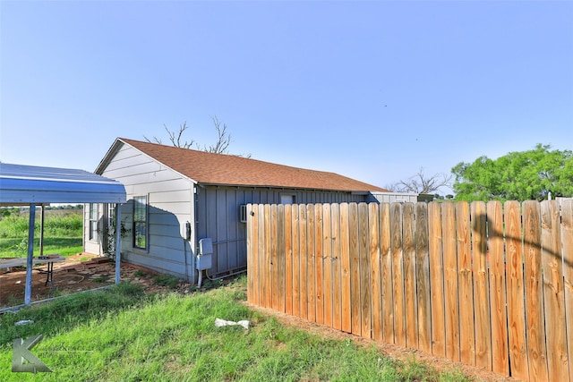 view of side of home featuring a yard