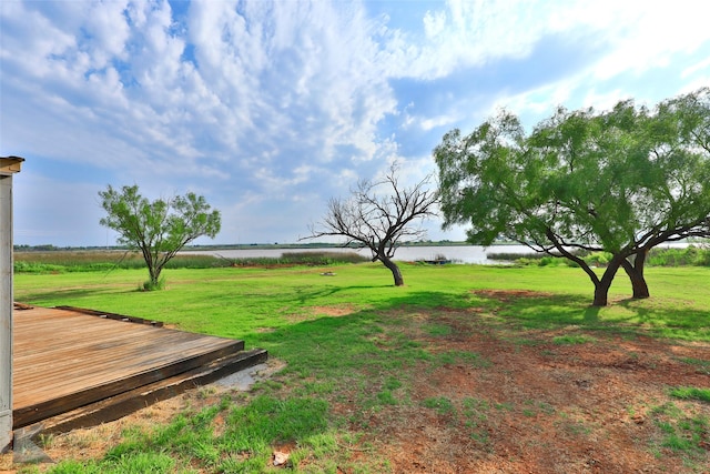 view of yard with a rural view and a water view