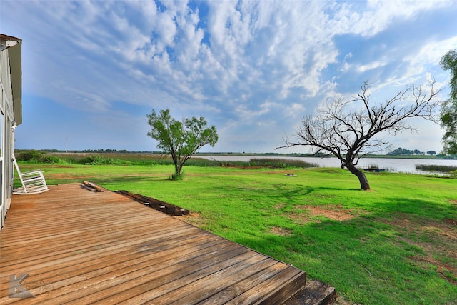 exterior space with a yard and a water view