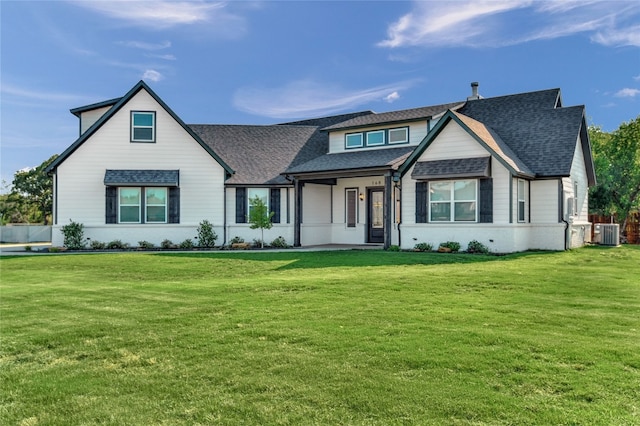 modern farmhouse featuring a front yard and central AC unit