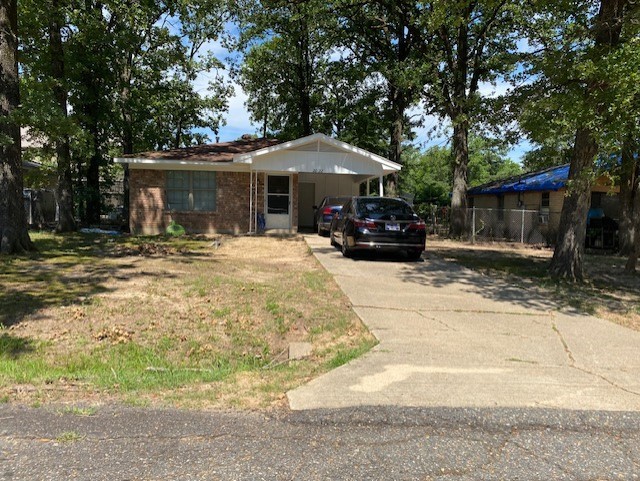 view of front facade with a carport