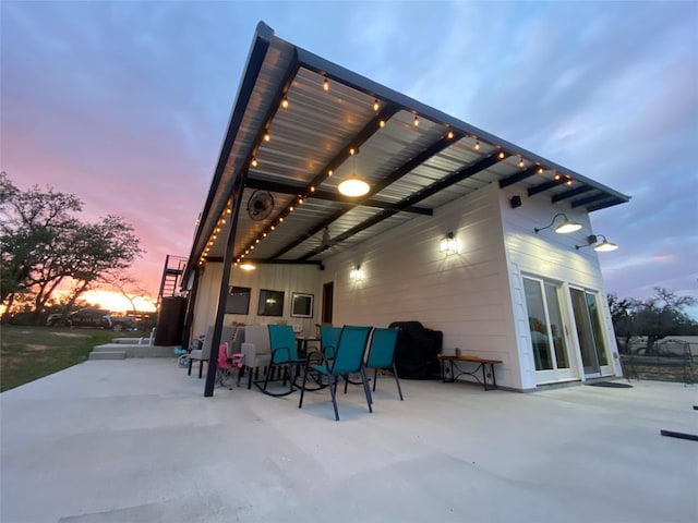 view of patio terrace at dusk