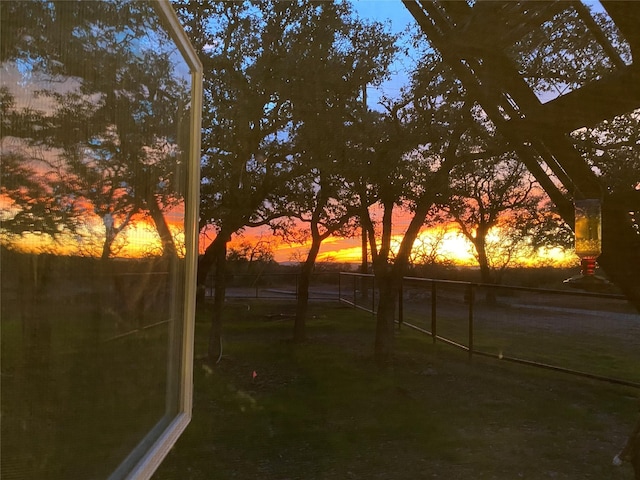 view of yard at dusk