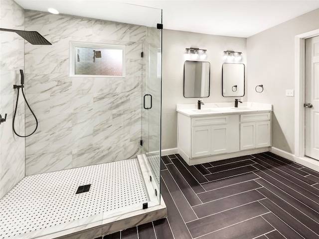 bathroom featuring an enclosed shower, tile flooring, and double vanity