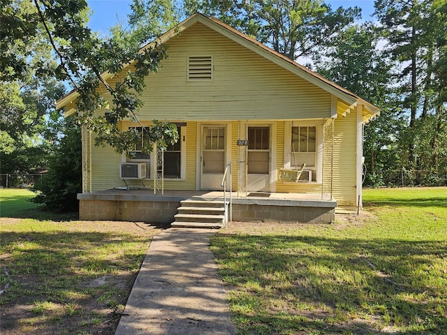 bungalow with a porch and a front yard