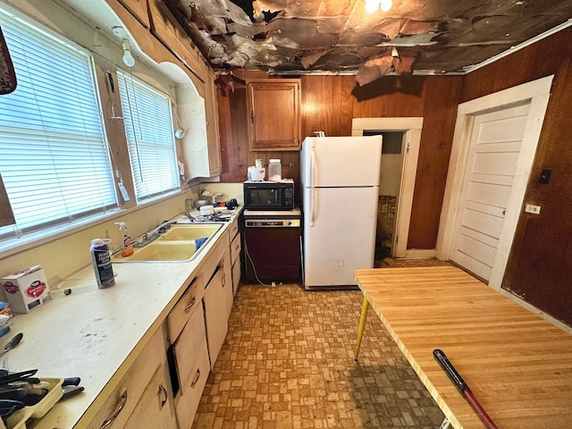 kitchen featuring black appliances and sink